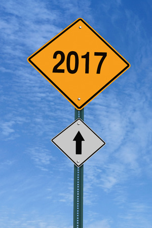 2017 ahead road sign over blue sky with cloudsの写真素材