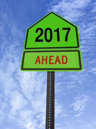 2017 ahead road sign over blue sky with cloudsの写真素材