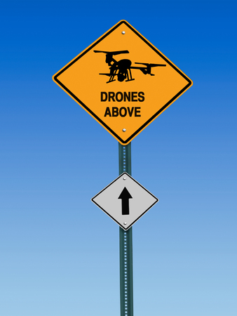 conceptual sign with drone symbol and  warning above over blue skyの写真素材