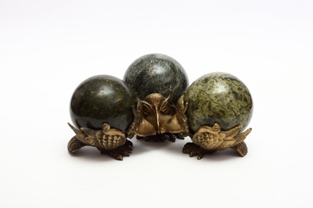 bronze figurines eagle with a ball on the back of the jadeiteの写真素材