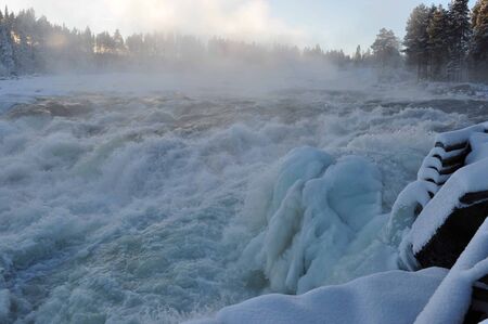 Storforsen waterfall in scandinavia in winterの写真素材