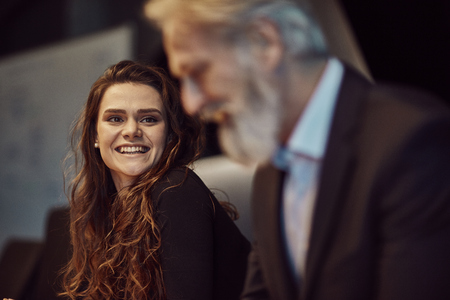 handsome caucasian senior CEO at a meeting with his young beautiful apprentice. Job interviewの写真素材