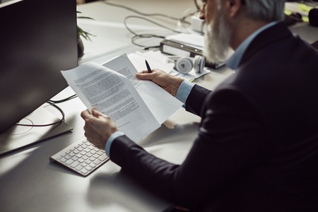 handsome caucasian senior CEO at a meeting with his young beautiful apprentice.の写真素材