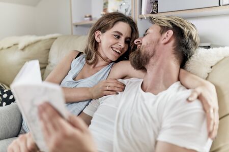 cosy morning on the sofa with a bookの写真素材