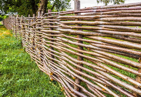 Rustic wicker fence around the perimeter of the private courtyard.の写真素材
