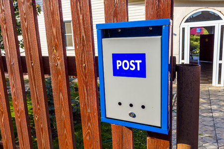 Mail box on the fenceの写真素材