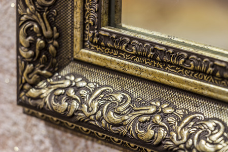 Part of the ornate, carved mirror frame in ancient styleの写真素材