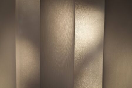 Soft beige background as net curtains on the window