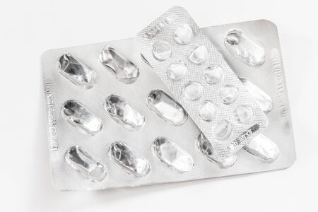 Empty packaging of pills close-up on a light backgroundの写真素材