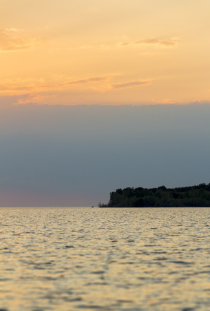Beautiful landscape of the evening sunset on the lakeの写真素材