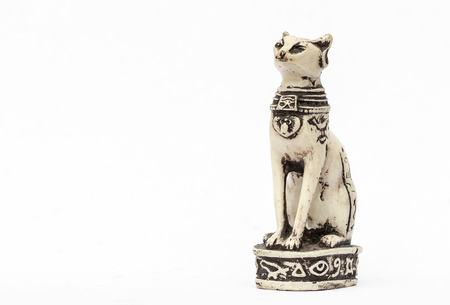 Statuette of the Egyptian cat close up on a white background.の写真素材