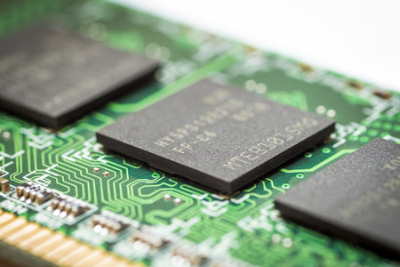 Computer chip closeup on a white background.の写真素材