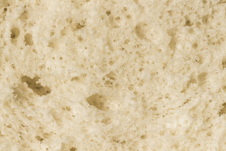 The surface of the slice of bread close-up as a background.