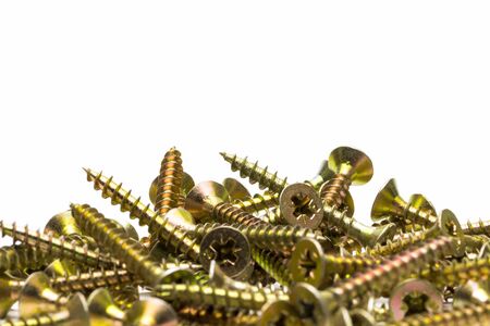 Heap of wood screws closeup on white background.の写真素材