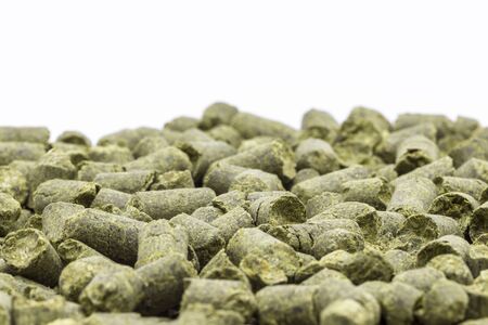 Hop in granules close up on a white background.の写真素材