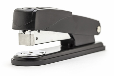 Stationery black office stapler close up on a white background.の写真素材