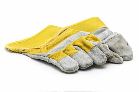 Suede construction gloves closeup on a white background.の写真素材