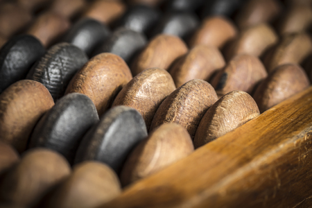 Old forgotten abandoned wooden abacus close-up.の写真素材