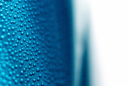 Air bubbles on the wall of the vessel with water close-up as a background.の写真素材