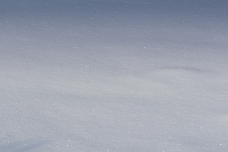 Smooth surface shining blue snow.の写真素材