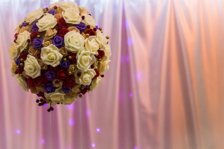 A festive ball of flowers close-up in the hall for celebration.の写真素材