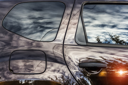 The shiny car paintwork surface is like an abstraction.の写真素材