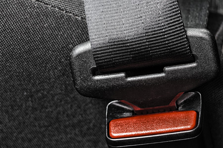 Lock the seat belt of a car close-up.