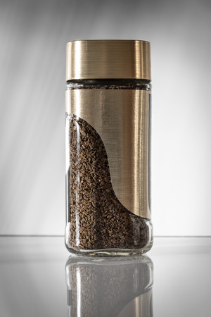 A modern jar with instant coffee close-up.の写真素材