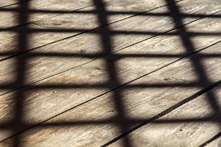 Shadow on a wooden plank floor gazebos.