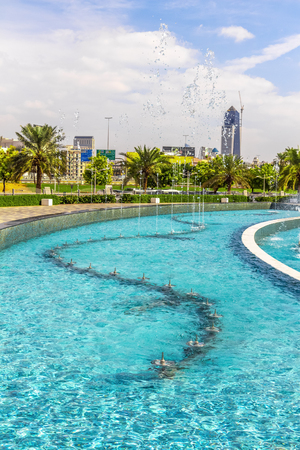 Dubai, UAE - November 28, 2018: Pure turquoise water in the pool with fountains near Dubai Frame.のeditorial素材