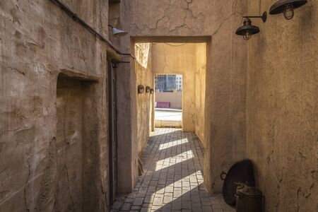 A narrow street in the old town of clay houses.