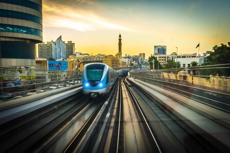 Dubai, UAE - November 30, 2018: View from the cabin window on the rail road in the background of the...