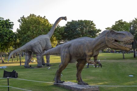 Dubai, UAE - December 3, 2018: Fragments of moving figures of the Dubai Dinosaur Park. Zabeel...