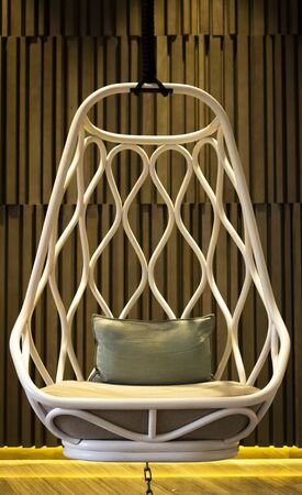 Original hanging white chair in the lobby.