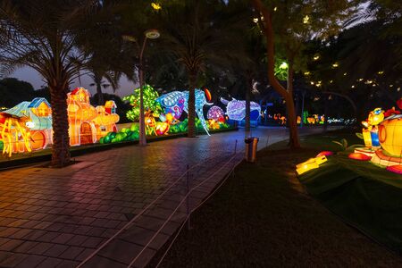Dubai, UAE - December 3, 2018: Beautiful installations at the Dubai Garden Glow family theme park illuminated at night.のeditorial素材