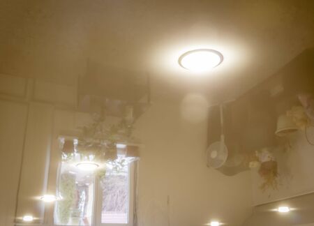 Built-in LED ceiling lights on a glossy stretch ceiling.
