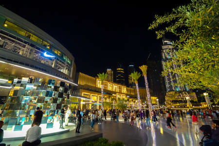 Dubai, UAE - November 29, 2018: Downtown Dubai district. View of the central square near the Dubai Mall in the evening.のeditorial素材