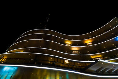 Dubai, UAE - November 29, 2018: Futuristic urban architecture with evening color illumination. Dubai Mall the largest shopping center.のeditorial素材
