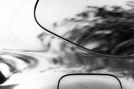 A fragment of the side of the car close-up as an abstraction.の写真素材