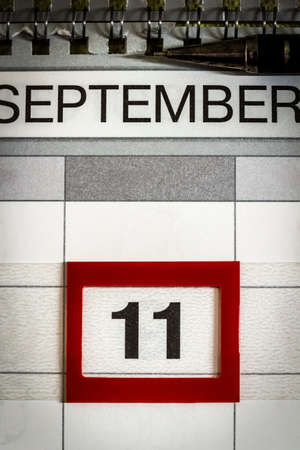 The date September 11 is highlighted on the wall calendar.の写真素材