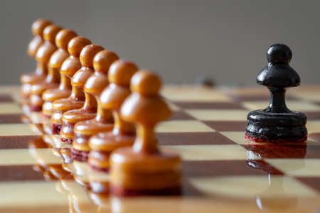 One pawn is positioned against a row of enemy pawns.