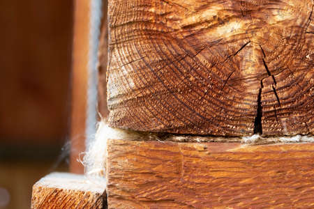 Corner of a wooden log cabin of an old rural house.の写真素材