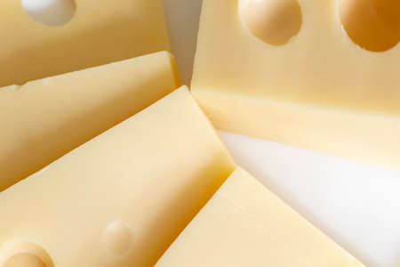 The cheese lies on a close-up of a white porcelain plate.