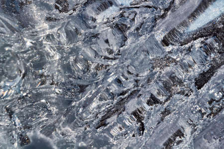 Abstract shapes from ice on a background of blue sky.の写真素材
