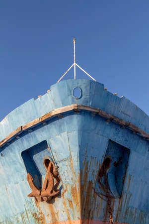 Rusty anchor of an old ship in a junkyard.の写真素材