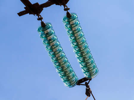 High voltage electrical lines and equipment against the blue sky.