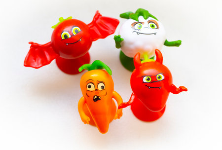 Small children's figurines of vegetables close-up on a white background.の写真素材