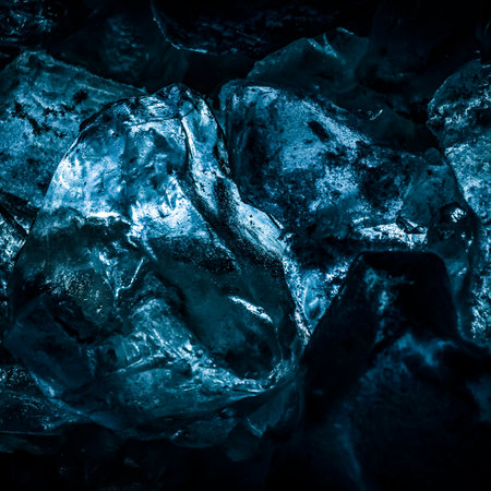 Pieces of cold ice with blue backlight closeup.の写真素材
