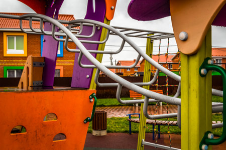 Colorful outdoor playground equipment with slides, swings and carousels.の写真素材