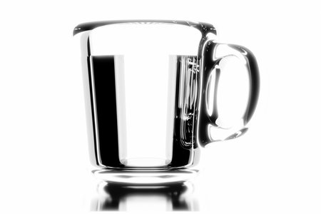 Glass mug with water on a white background close-up.の写真素材